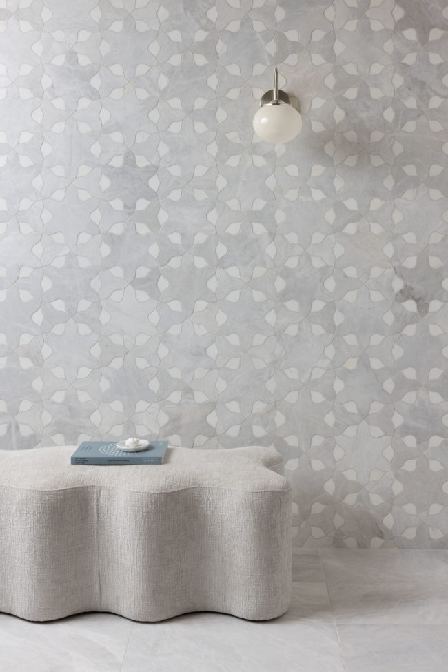 Dyad tile collection featuring Imala Mystic Silver Dolomite installation. Grey and white marble mosaic wall tile with grey marble field tile floor. 